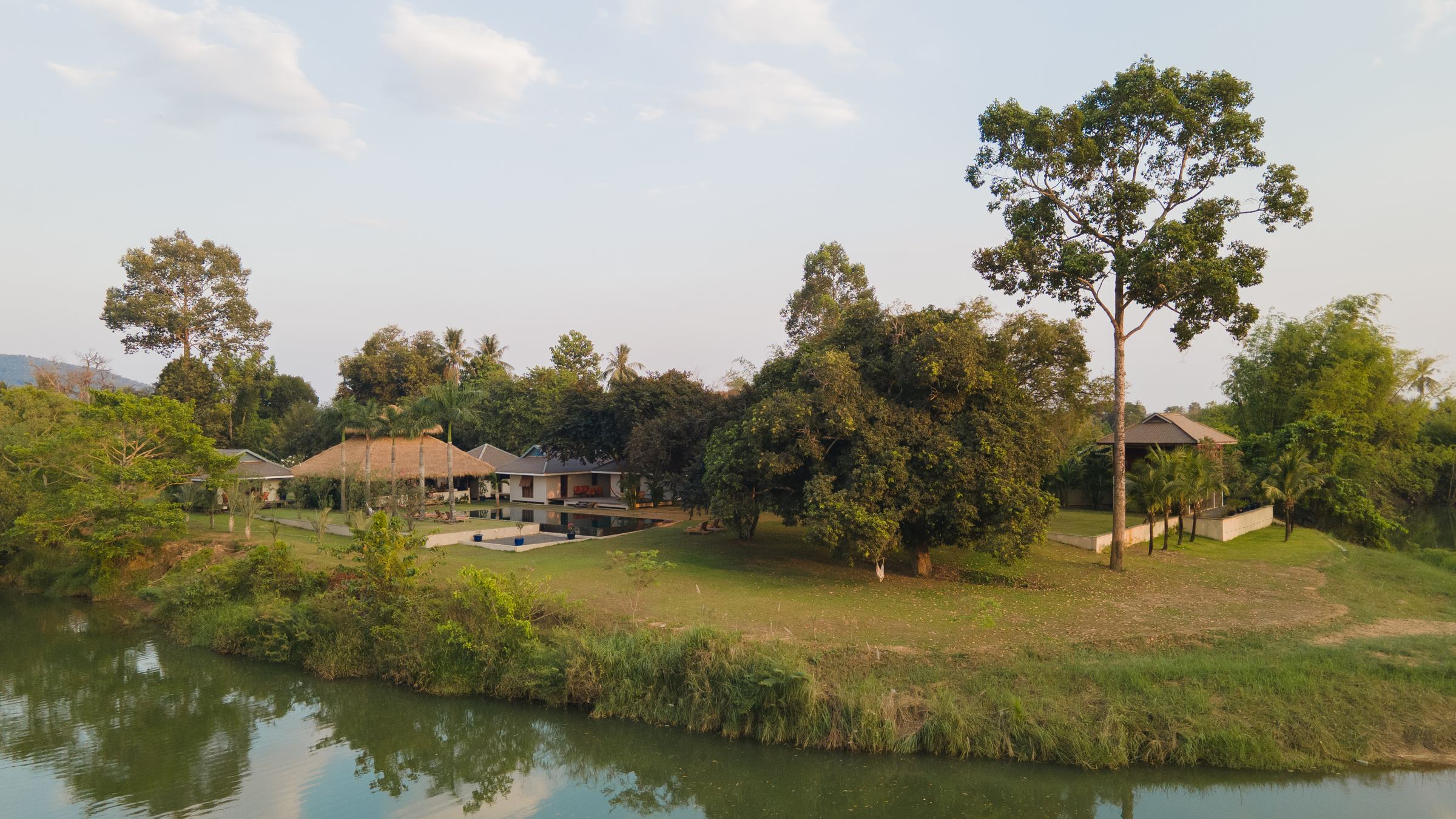 Aerial view of Khla Lodge beside the river, Kampot